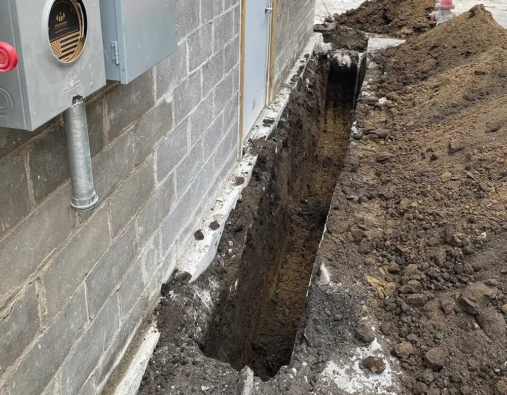 Trench for Sewer Line Near Building