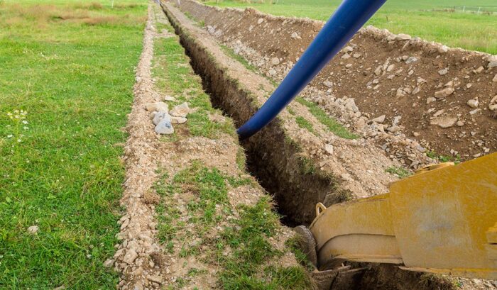 Water Line Being Installed in Trench